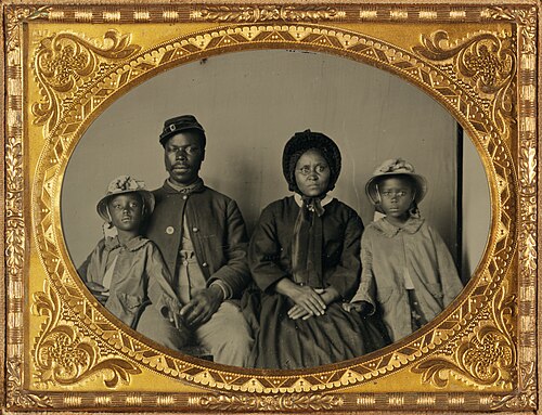 Unidentified African American Union soldier with his family, c. 1863-1865